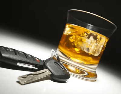 Whiskey glass and car keys